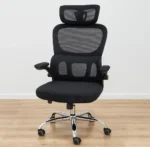 Ergonomic black mesh high-back office chair with an adjustable headrest, flip-up padded armrests, and a polished chrome swivel base.