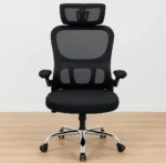 Ergonomic black mesh high-back office chair with an adjustable headrest, flip-up padded armrests, and a polished chrome swivel base.