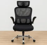Ergonomic black mesh high-back office chair with an adjustable headrest, flip-up padded armrests, and a polished chrome swivel base.