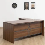 Modern walnut 1.8m L-shaped executive desk featuring a decorative geometric front modesty panel and an integrated side return with three locking drawers.