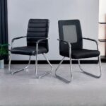 Black mesh medium-back conference chair with integrated armrests and a chrome sled base frame.