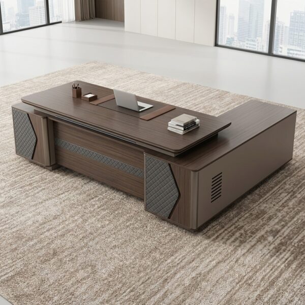 2.4m L-shaped executive table showcasing a premium dark walnut wood grain finish, featuring a tiered floating main desktop with a built-in brown leather desk blotter inlay and a pop-up silver media hub, an integrated low-profile side return credenza, and a heavy-duty front modesty panel detailed with gray diamond-quilted upholstered accents.