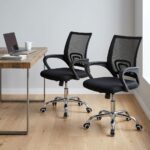 Black clerical office chair shown in a pair from front and angled perspectives, featuring a breathable black mesh mid-back backrest with integrated lumbar support, a contoured fabric-padded seat cushion, fixed curved nylon armrests, a pneumatic height-adjustment mechanism, and a polished chrome five-star swivel base on dual-wheel casters.