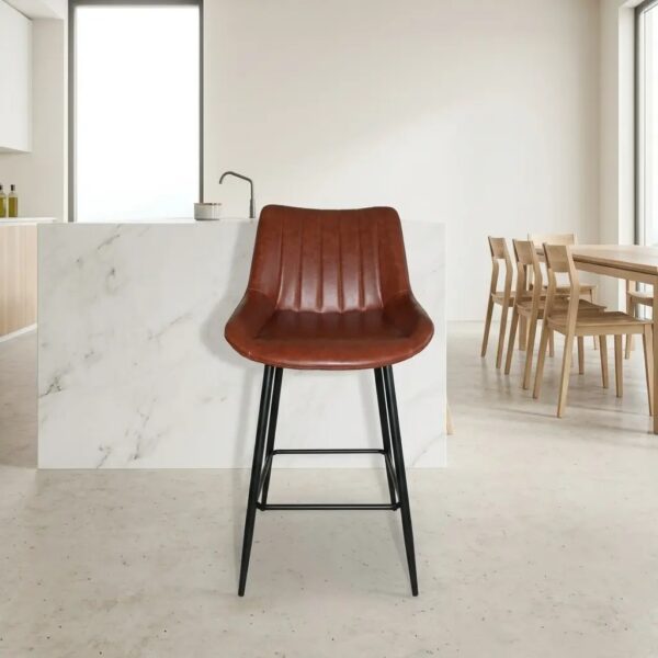 Brown faux leather bar stool featuring a vertical channeled backrest, molded bucket seat, and black metal tapered legs with a built-in footrest.