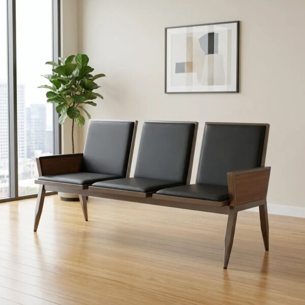 3-seater black waiting bench featuring three individual interconnected seats with smooth black faux leather padded backrests and seat cushions, integrated enclosed armrests with matching black upholstered panels, and a sturdy matte gunmetal gray metallic frame with tapered angular legs.