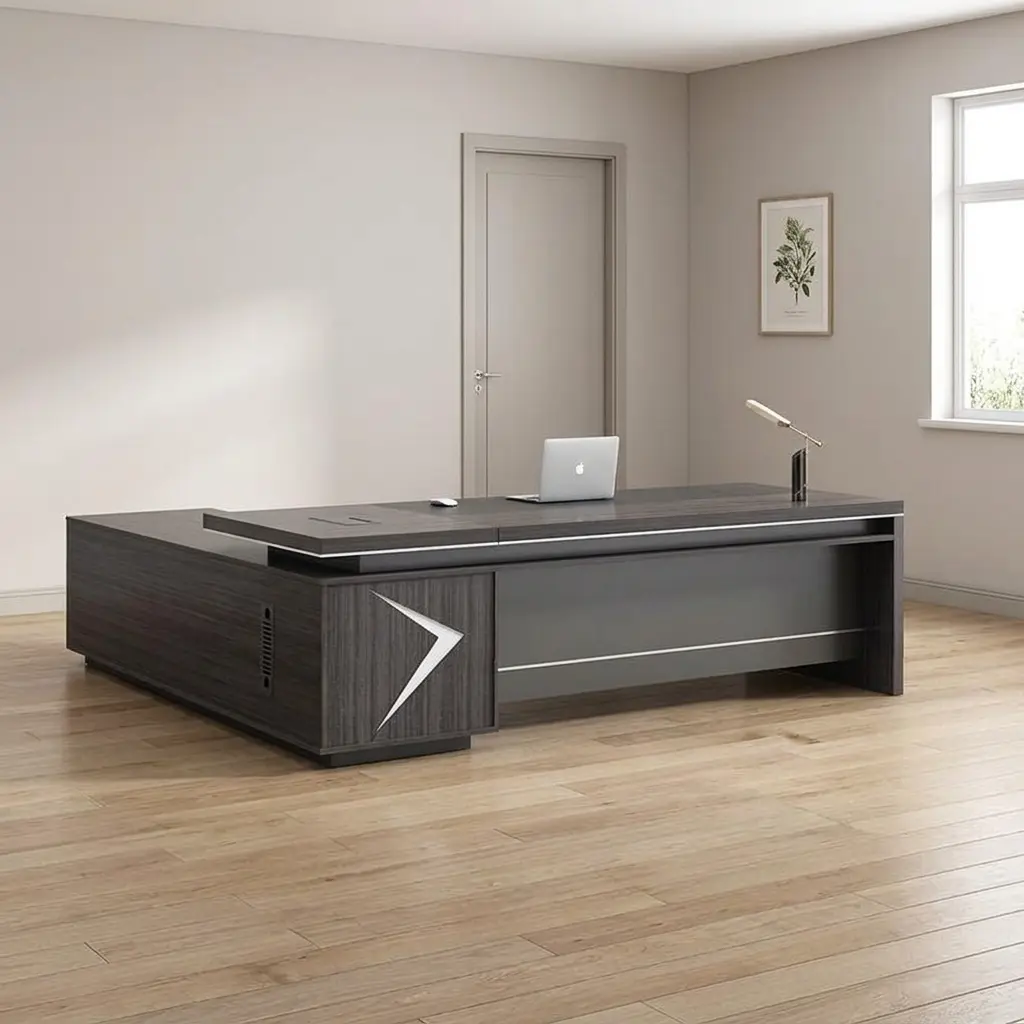 1.6m L-shaped executive table finished in a dark charcoal wood grain veneer, featuring a floating-style desktop with integrated metal trim accents, a large built-in side return credenza, a matte gray front modesty panel, and an illuminated chevron or arrowhead LED light inlay on the front support pedestal.