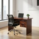 Wooden 0.9m office desk with three locking drawers paired with a black mesh ergonomic swivel chair in a modern workspace.