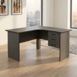 1.2M curved office desk in a sleek charcoal gray matte finish, featuring a smooth L-shaped corner tabletop with an integrated cable grommet, a matching privacy modesty panel, and an attached three-drawer under-desk storage pedestal with lockable top drawer and curved handles.