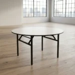 White foldable meeting table featuring a smooth, circular white laminate tabletop with a protective black edge band, supported by a heavy-duty matte black metal frame with collapsible folding legs and integrated locking stability braces.