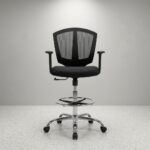 Adjustable Mesh Cashier Chair Improve comfort and efficiency with this Adjustable Mesh Cashier Chair, designed to provide ergonomic support, breathability, and long-lasting durability. It is an ideal seating solution for cashiers, reception desks, customer service counters, supermarkets, banks, pharmacies, retail stores, and office workstations. Its modern mesh design promotes airflow while ensuring maximum comfort during extended working hours. Manufactured with premium materials and a reinforced frame, this adjustable mesh cashier chair is built for everyday commercial use. As a result, it offers reliable performance and exceptional comfort in busy working environments. Ergonomic Mesh Support The breathable mesh backrest provides continuous airflow, helping users stay cool throughout the day. Consequently, it reduces heat buildup and improves comfort during long shifts. Additionally, the ergonomic backrest supports the natural curve of the spine, encouraging healthy posture and reducing lower back fatigue. The padded seat cushion provides excellent comfort while maintaining its shape after regular use, making the chair suitable for prolonged sitting. Adjustable Features This cashier chair includes an adjustable seat height mechanism, allowing users to customize the chair according to counter height and personal preference. The supportive foot ring provides additional comfort by reducing pressure on the legs during extended working periods. The 360-degree swivel function enables effortless movement, allowing users to access workstations and equipment without unnecessary strain. Smooth caster wheels further improve mobility across various floor surfaces. Durable Construction Built with a heavy-duty frame and stable base, this chair delivers outstanding strength and durability for daily commercial use. The quality mesh upholstery resists wear while maintaining a modern professional appearance. Moreover, the reinforced construction ensures dependable support throughout years of continuous operation. The mesh and seat surfaces are also easy to clean, requiring minimal maintenance to maintain a neat appearance. Modern Professional Design Its contemporary design complements reception counters, cashier stations, office desks, and retail environments. As a result, it blends seamlessly with modern commercial interiors while enhancing workplace comfort and efficiency. Key Features Premium adjustable mesh cashier chair Breathable ergonomic mesh backrest Comfortable padded seat Adjustable seat height Supportive foot ring 360-degree swivel function Smooth caster wheels Heavy-duty stable base Benefits Promotes healthy sitting posture Reduces fatigue during long shifts Improves workplace comfort and productivity Provides long-lasting durability Ideal for supermarkets, banks, pharmacies, retail stores, reception areas, cashier counters, and office workstations