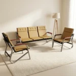 Beige leather 5-seater reception sofa set comprising a 3-seater bench and two matching single armchairs with curved metal frames.