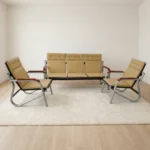 Beige leather 5-seater reception sofa set comprising a 3-seater bench and two matching single armchairs with curved metal frames.