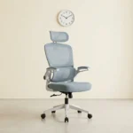 Light blue high-back executive ergonomic office chair with a mesh backrest, matching headrest, flip-up armrests, and a white 5-star swivel base.