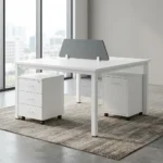 White 2-way modular workstation desk with a center gray privacy screen and two under-desk mobile filing cabinets.