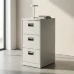 White steel 3-drawer filing cabinet with black recessed handles and a central key lock system.