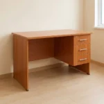 1.0m office study desk finished in a warm cherry wood grain laminate, featuring a rectangular writing surface, an integrated three-drawer side pedestal on the right with a top-drawer key lock, modern silver horizontal bar handles, a solid left panel leg support, and a matching wood modesty panel.