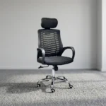 Black headrest office chair featuring a high backrest in breathable black mesh with a horizontal chevron spine support design, an independent cushioned fabric headrest, fixed sloping loop armrests, a padded black fabric seat cushion, a pneumatic height-adjustment lever, and a polished chrome five-star swivel base equipped with hooded dual-wheel casters.