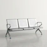 3 seater heavy duty waiting bench constructed from durable silver powder-coated steel, featuring three interconnected seats with perforated mesh backrests and contoured seating surfaces, bordered by polished chrome loop armrests on each end, and supported by heavy-duty arched metal legs with adjustable leveling glides.