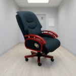 Executive reclining office chair shown in a side profile, featuring a high-back design upholstered in tufted black bonded leather with contrasting red stitching, constructed with curved wooden armrests and accents finished in a rich cherry wood stain, an integrated silver mechanical recline lever on the side panel, and a matching cherry-stained five-star swivel base with dual-wheel casters.