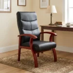 High back leather waiting chair featuring segmented black leather upholstery with horizontal stitching, curved cherry wood armrests, and matching flared wooden legs.