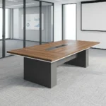 3m conference meeting table featuring a natural wood-grain tabletop with white edge trim, a central silver and black media connectivity track flanked by two rectangular grommet covers, and dual charcoal gray block pedestal legs.