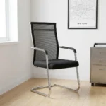 Mesh office guest chair featuring a high, transparent black mesh backrest with a slim chrome top rail, integrated black curved armrests, a contoured padded fabric seat, and a polished chrome cantilever sled base.