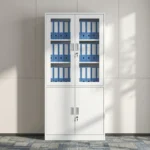 Lockable steel office file cabinet featuring a clean white finish, an upper lockable double-door cupboard with glass display windows revealing interior shelving, and a lower matching solid steel double-door storage cabinet with vertical metal handles.