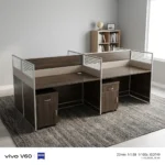 4-way modular workstation featuring a rich dark wood-grain finish, central and side privacy divider panels with white-slatted top accents, circular white cable grommets, and two matching under-desk mobile pedestals, each equipped with a top drawer and a lower cabinet door with silver handles.