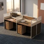 4-way modular workstation featuring a rich dark wood-grain finish, central and side privacy divider panels with white-slatted top accents, circular white cable grommets, and two matching under-desk mobile pedestals, each equipped with a top drawer and a lower cabinet door with silver handles.