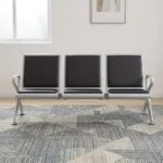 3-link black waiting bench featuring a robust three-seater silver metallic frame, padded black leather seat and backrest cushions for each section, integrated curved silver armrests at both ends, and angled support legs with adjustable leveling feet.