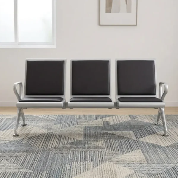 3-link black waiting bench featuring a robust three-seater silver metallic frame, padded black leather seat and backrest cushions for each section, integrated curved silver armrests at both ends, and angled support legs with adjustable leveling feet.