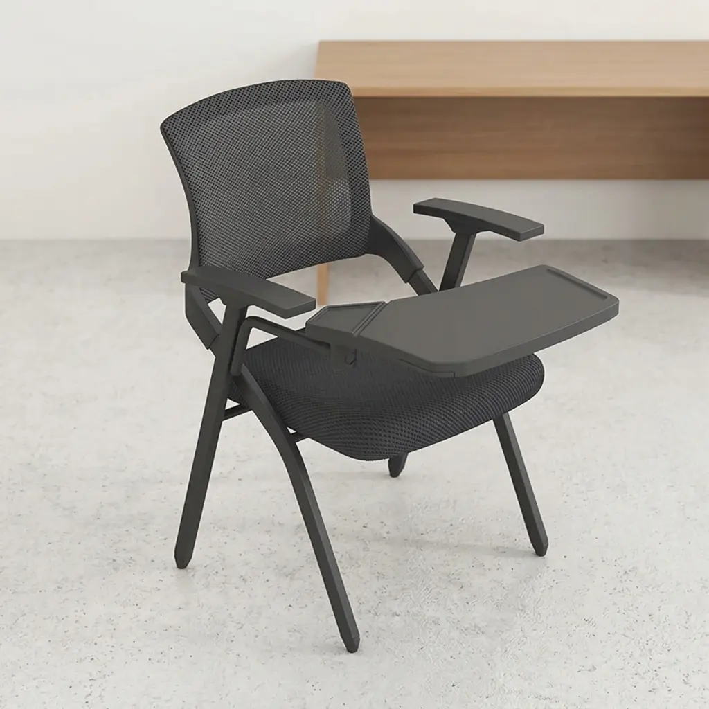 Black foldable training chair featuring a mid-back black mesh backrest, an integrated black writing tablet arm, flat T-shaped armrests, a contoured padded black fabric seat, and a sturdy matching black four-legged folding frame.