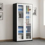 Full glass lockable file cabinet featuring a modern two-tone design with a black outer frame and white-trimmed double doors, large clear glass panels showcasing multi-tier internal shelving, a sleek integrated vertical handle, and a central key-lock mechanism.