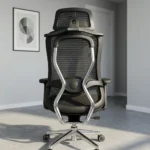 Ergonomic orthopedic office staff chair featuring a high-back design with an adjustable mesh headrest, a contoured black mesh backrest supported by an integrated skeletal lumbar structure, flat T-shaped adjustable armrests, a thickly cushioned black fabric seat, and a polished aluminum five-star swivel base on dual-wheel casters.