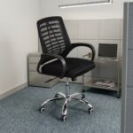 Mid-back mesh staff chair featuring a contoured black mesh backrest with a slatted or ribbed horizontal support skeleton, curved black loop armrests, a thickly padded black fabric seat cushion, and a polished chrome five-star swivel base equipped with twin-wheel casters.