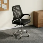 Mid-back mesh staff chair featuring a contoured black mesh backrest with a slatted or ribbed horizontal support skeleton, curved black loop armrests, a thickly padded black fabric seat cushion, and a polished chrome five-star swivel base equipped with twin-wheel casters.