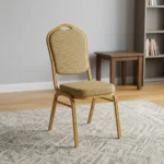 Stackable brown conference chair featuring a crown-top backrest with a cut-out handle and a thick square seat cushion, both upholstered in a textured light-brown or beige patterned fabric, shown in a vertical stack of three supported by a sturdy gold-finished metallic frame with integrated stacking bumpers.