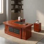 2.0m executive office desk featuring a rich reddish-brown wood-grain finish, an L-shaped layout with an attached side return credenza, an embedded black leather desktop writing pad, a front modesty panel decorated with two columns of segmented black textured panels, and a matching independent three-drawer mobile filing pedestal.