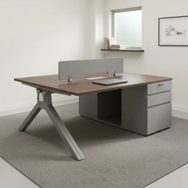 2-seater modular workstation featuring back-to-back warm wood-grain tabletops separated by a central acoustic fabric privacy screen, integrated cable grommets, sturdy angled A-frame metal support legs on one side, and a light gray multi-drawer pedestal storage base on the other.