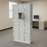 15-locker steel filing cabinet featuring a durable light-gray metal frame organized in a 3-column by 5-row grid of individual compartments, each equipped with an integrated vertical handle, label holder slot, individual key lock, and lower ventilation louvers