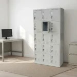 15-locker steel filing cabinet featuring a durable light-gray metal frame organized in a 3-column by 5-row grid of individual compartments, each equipped with an integrated vertical handle, label holder slot, individual key lock, and lower ventilation louvers