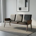 Heavy duty reception bench featuring a 3-seat design upholstered in sleek black leather with padded backrests and seat cushions, supported by a robust dark walnut-finish wood frame with angled legs and wood-paneled side armrests.