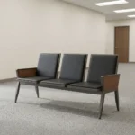 Heavy duty reception bench featuring a 3-seat design upholstered in sleek black leather with padded backrests and seat cushions, supported by a robust dark walnut-finish wood frame with angled legs and wood-paneled side armrests.