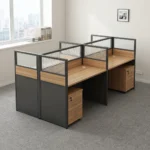 4-seater modular office workstation featuring four light oak-finish desktops configured in a 2x2 pod, enclosed by semi-private partition screens with solid charcoal lower panels, light wood accents, and translucent corrugated glass top sections, with each desk equipped with an under-desk three-drawer lockable pedestal cabinet.