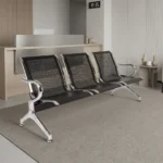 3-seater black reception bench featuring perforated black metal backrests and contoured seats, curved chrome armrests, and a sturdy chrome frame with sloped support legs and leveling feet.