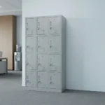 12-locker filing cabinet featuring a durable light-gray steel frame arranged in a 3-column by 4-row grid, with each individual compartment fitted with an inset vertical handle, key-lock security mechanism, label holder slot, and lower ventilation louvers.