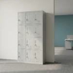 12-locker filing cabinet featuring a durable light-gray steel frame arranged in a 3-column by 4-row grid, with each individual compartment fitted with an inset vertical handle, key-lock security mechanism, label holder slot, and lower ventilation louvers.
