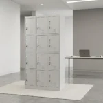 12-locker filing cabinet featuring a durable light-gray steel frame arranged in a 3-column by 4-row grid, with each individual compartment fitted with an inset vertical handle, key-lock security mechanism, label holder slot, and lower ventilation louvers.