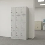 12-locker filing cabinet featuring a durable light-gray steel frame arranged in a 3-column by 4-row grid, with each individual compartment fitted with an inset vertical handle, key-lock security mechanism, label holder slot, and lower ventilation louvers.