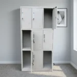 9-locker steel filing cabinet featuring a durable light-gray metal construction arranged in a 3-column by 3-row grid, with individual lockable compartments equipped with inset vertical handles, key-lock mechanisms, label holder slots, and lower ventilation louvers.